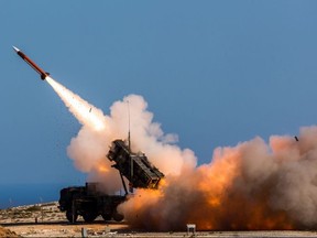 In this Wednesday, Nov. 8, 2017 released by the U.S. Department of Defense, German soldiers assigned to Surface Air and Missile Defense Wing 1, fire the Patriot weapons system at the NATO Missile Firing Installation, in Chania, Greece. U.S. defense giant Lockheed Martin says the company is delivering its Patriot anti-missile system to Saudi Arabia and that the kingdom is on track to become the second international customer, after the United Arab Emirates, to acquire its THAAD system. (Sebastian Apel/U.S. Department of Defense, via AP)