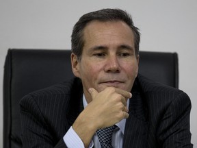 In this May 29, 2013 photo, Alberto Nisman, the prosecutor investigating the 1994 bombing of the Argentine-Israeli Mutual Association community center, talks to journalists in Buenos Aires, Argentina.