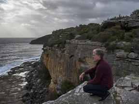 Steve Johnson on the cliff face at Fairy Bower, overlooking the spot where the body of his brother, Scott Johnson, was found, in Sydney on Dec. 17, 2016.