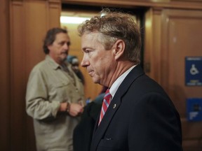 FILE- In this Nov. 13, 2017 file photo, Sen. Rand Paul, R-Ky., arrives on Capitol Hill in Washington.  Paul says a man who tackled him in his yard spoke to him afterward about why he was unhappy, but Paul said no explanation would have justified what he called an unprovoked attack. Paul spoke about the assault for the first time publicly with the Fox News Channel, which aired a portion of the interview on its website Tuesday, Nov. 28. (AP Photo/Pablo Martinez Monsivais, File)