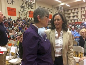 FILE - In this Saturday, Oct 14, 2017 file photo, U.S. Sen. Kamala Harris, D-Calif., right, speaks to resident Pat Sabo, 67, a retired school teacher who was evacuated from her Santa Rosa, Calif., neighborhood. As Tuesday's contest headed for a runoff pitting Keisha Lance Bottoms against Mary Norwood, social media was abuzz with the thought of a "Mayor Keisha." Recent cycles have seen voters have cast ballots for mayor-elect Chokwe Lumumba in Jackson, Mississippi, Newark Mayor Ras Baraka, and California Senator Kamala Harris. (AP Photo/Sudhin Thanawala, File)