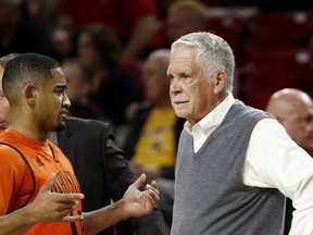 Idaho State head coach Bill Evans, right, talks with guard Brandon Boyd, left, during the first half of an NCAA basketball game against Arizona State, Friday, Nov. 10, 2017, in Tempe, Ariz. (AP Photo/Ross D. Franklin)