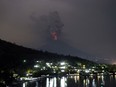 A view of the Mount Agung volcano erupting in Karangasem, Bali, Indonesia, Monday, Nov. 27, 2017. Indonesia authorities raised the alert for the rumbling volcano to highest level on Monday and closed the international airport on the tourist island of Bali stranding thousands of travelers.