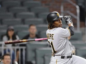 In this May 24 file photo, Pittsburgh Pirates second baseman Gift Ngoepe doubles against the Atlanta Braves.