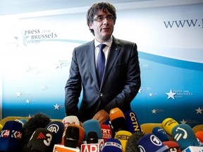 Carles Puigdemont, Catalonia's president, arrives for a news conference at the Press Club in Brussels, Belgium, on Tuesday, Oct. 31, 2017. Ousted Catalan leader Puigdemont said he fled Spain for fear he and his government wouldnt get a fair trial, as he said he wouldnt risk violence to press the case for independence.