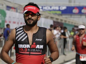 FILE - In this Dec. 5, 2015 file photo, Sheikh Nasser bin Hamad Al Khalifa, the son of Bahrain's king, runs in Bahrain's Ironman 70.3 triathlon in Sekhir, Bahrain. The activist group, Americans for Democracy and Human Rights in Bahrain, sent letters Wednesday to the U.S. State Department and Defense Department on Wednesday, Nov. 1, 2017, asking the U.S. to suspend a diplomatic visa for Prince Nasser over allegations he tortured prisoners during the island kingdom's 2011 Arab Spring protests. (AP Photo/Hasan Jamali, File)