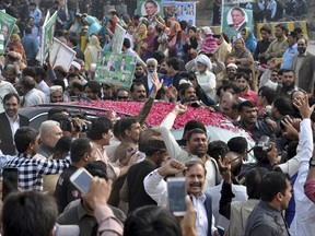 Supporters of Pakistan's ousted prime minister Nawaz Sharif shout slogans as he left an accountability court in Islamabad, Pakistan, Friday, Nov. 3, 2017. Sharif has appeared before an anti-graft court where his lawyer has asked the judges to merge three corruption cases against him into one. (AP Photo/B.K. Bangash)