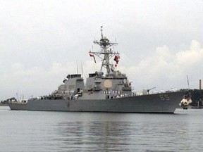 FILE - In this Aug. 8, 2016, file photo, the guided missile destroyer USS Benfold arrives at port in Qingdao, China. According to the U.S. Navy 7th Fleet, a Japanese tug boat lost propulsion and drifted into the USS Benfold during a towing exercise in Sagami Bay on Saturday, Nov. 18, 2017. (AP Photo/Borg Wong, File)