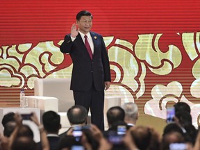 China's President Xi Jinping arrives to speak on the final day of the APEC CEO Summit, part of the broader Asia-Pacific Economic Cooperation (APEC) leaders' summit, in Danang, Vietnam, Friday, Nov. 10, 2017. (Anthony Wallace/Pool Photo via AP)