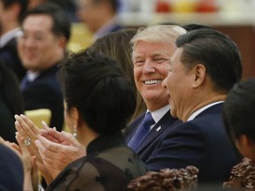 U.S. President Donald Trump and China's President Xi Jinping attend at a state dinner at the Great Hall of the People in Beijing, China, Thursday, Nov. 9, 2017. (Thomas Peter/Pool Photo via AP)