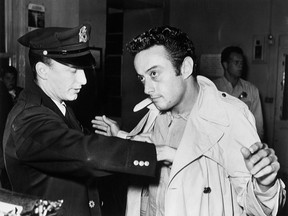 Lenny Bruce is processed by the San Francisco police after his arrest on October 4, 1961, for obscenity at the Jazz Workshop.