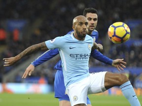 Manchester City's Fabian Delph, front, and Leicester City's Vicente Iborra battle for the ball during the English Premier League soccer match between Leicester City and Manchester City at the King Power Stadium in Leicester, England, Saturday, Nov. 18, 2017. (AP Photo/Rui Vieira)