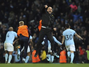 Manchester City manager Josep Guardiola celebrates after Manchester City's Raheem Sterling scored his side second goal during the English Premier League soccer match between Manchester City and Southampton at Etihad stadium, in Manchester, England, Wednesday, Nov. 29, 2017. (AP Photo/Rui Vieira)