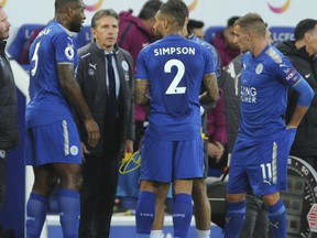 Leicester Manager Claude Puel, centre, speaks to his players during the English Premier League soccer match between Leicester City and Manchester City at the King Power Stadium in Leicester, England, Saturday, Nov. 18, 2017. (AP Photo/Rui Vieira)