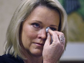 Former Boston television news anchor Heather Unruh wipes tears while speaking Wednesday, Nov. 8, 2017, in Boston, about the alleged sexual assault of her teenage son by actor Kevin Spacey in the summer of 2016 on Nantucket. (AP Photo/Bill Sikes)