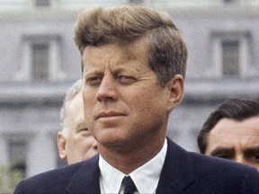 FILE - In this April 30, 1963 file photo, President John F. Kennedy listens while Grand Duchess Charlotte of Luxembourg speaks outside the White House in Washington. National Park Rangers will lay a wreath outside Kennedy's childhood home on Wednesday, Nov. 22, 2017, in Brookline Mass., 54 years to the day after he was assassinated in Dallas. The ceremony marks a symbolic end to a year of events marking the 100th anniversary of JFK's birth. (AP Photo/William J. Smith, File)