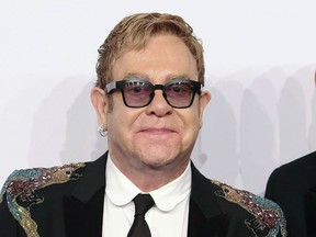 FILE - This Nov. 2, 2016 file photo shows Elton John at the Elton John AIDS Foundation's 15th Annual An Enduring Vision Benefit in New York. The 70-year-old singer will be awarded the Harvard Foundation's Peter J. Gomes Humanitarian Award, for his philanthropic efforts to fight HIV and AIDS, on Monday afternoon, Nov. 6, 2017, at Harvard University in Cambridge, Mass. (Photo by Greg Allen/Invision/AP, File)
