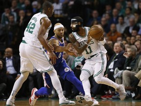Philadelphia 76ers' Jerryd Bayless (0) tries to get to through a pick by Boston Celtics' Al Horford to get to Kyrie Irving (11) during the first quarter of an NBA basketball game in Boston on Thursday, Nov. 30, 2017. (AP Photo/Winslow Townson)