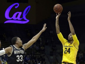 California's Marcus Lee, right, shoots over Wofford's Cameron Jackson, left, during the first half of an NCAA college basketball game Thursday, Nov. 16, 2017, in Berkeley, Calif. (AP Photo/Ben Margot)
