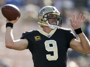 New Orleans Saints quarterback Drew Brees warms up before an NFL football game against the Los Angeles Rams, Sunday, Nov. 26, 2017, in Los Angeles. (AP Photo/Kelvin Kuo)