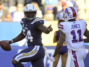 Los Angeles Chargers outside linebacker Melvin Ingram, left, scores past Buffalo Bills wide receiver Zay Jones during the second half of an NFL football game, Sunday, Nov. 19, 2017, in Carson, Calif. (AP Photo/Mark J. Terrill)