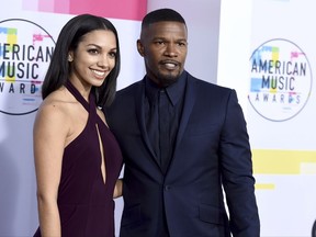 Jamie Foxx, right, and Corinne Foxx arrive at the American Music Awards at the Microsoft Theater on Sunday, Nov. 19, 2017, in Los Angeles. (Photo by Jordan Strauss/Invision/AP)