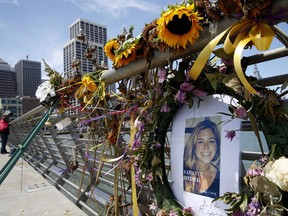 FILE - In this July 17, 2015 file photo, flowers and a portrait of Kate Steinle remain at a memorial site on Pier 14 in San Francisco. Jurors ended their fifth day of deliberations Wednesday, Nov. 29, 2017, without reaching a verdict in the murder trial that sparked a national debate over immigration policy. The six men and six women are deciding whether Jose Ines Garcia Zarate meant to shoot Steinle as charged or whether they believe his claim that the the shooting was accidental. (Paul Chinn/San Francisco Chronicle via AP, File)