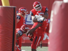 Fresno State's Netane Muti celebrates with Keesean Johnson after a touchdown against Boise State during the first half of an NCAA college football game in Fresno, Calif., Saturday, Nov. 25 2017. (AP Photo/Gary Kazanjian)