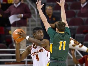 North Dakota State guard Jared Samuelson (11) guards Southern California forward Chimezie Metu (4) during the first half of an NCAA college basketball game, Monday, Nov. 13, 2017, in Los Angeles. (AP Photo/Gus Ruelas)