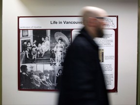 UVic historian Jordan Stanger-Ross is leading Landscapes of Injustice, a research project in the field of humanities in Canada about the letters of outrage reflecting injustices towards Japanese Canadians as he walks by Landscape of Injustice sign in the Sedgwick Building at the University of Victoria in Victoria, B.C., on Tuesday, November 7, 2017. THE CANADIAN PRESS/Chad Hipolito