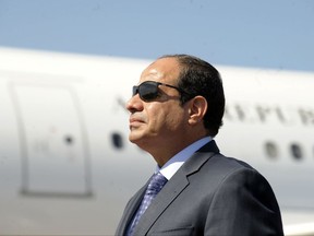 FILE - In this June 25, 2014, file photo, Egyptian President Abdel-Fattah el-Sissi stands at Algiers airport on his arrival to Algiers, Algeria.  In an interview with CNBC television that aired late Monday, `nov. 6, 2017, Egypt's leader says he is not in favor of amending the constitutional provisions barring the president from staying in office beyond two, four-year terms. (AP Photo/Sidali Djarboub, File)