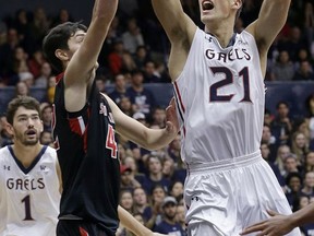 Saint Mary's (Cal.) center Evan Fitzner (21) shoots against St. Francis (Pa.) forward Mark Flagg during the first half of an NCAA college basketball game in Moraga, Calif., Saturday, Nov. 11, 2017. (AP Photo/Jeff Chiu)
