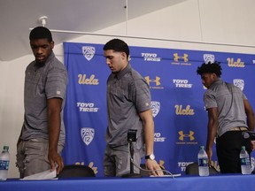 UCLA NCAA college basketball players Cody Riley, from left, LiAngelo Ball and Jalen Hill leave after giving their statements during a news conference at UCLA Wednesday, Nov. 15, 2017, in Los Angeles. The players were detained in Hangzhou following allegations of shoplifting last week before a game against Georgia Tech in Shanghai. (AP Photo/Jae C. Hong)