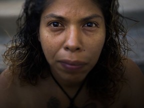 Bernadette Ortiz, 39, poses for a photo Tuesday, Oct. 24, 2017, in San Jose, Calif. Ortiz recently gave a birth to her fifth child. She and her fiance were living in a tent when she found out she was pregnant. The couple lives in a temporary shelter at a local church until their move to a studio apartment. "I don't want to live in a tent ever again," said Ortiz. (AP Photo/Jae C. Hong)