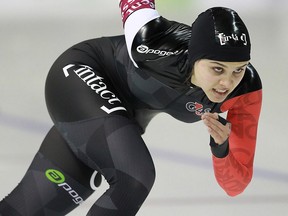In this Nov. 9, 2013 file photo, Marsha Hudey skates in the 500 metres at a World Cup event in Calgary.