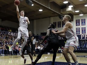 Saint Mary's guard Emmett Naar (3) drives to the basket against New Mexico State during the first half of an NCAA college basketball game Monday, Nov. 13, 2017, in Moraga, Calif. (AP Photo/Marcio Jose Sanchez)