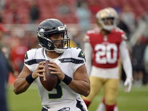Seattle Seahawks quarterback Russell Wilson warms up before an NFL football game against the San Francisco 49ers Sunday, Nov. 26, 2017, in Santa Clara, Calif. (AP Photo/Don Feria)