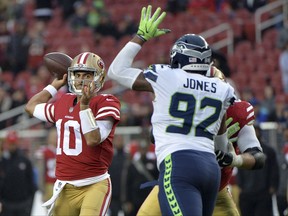 San Francisco 49ers quarterback Jimmy Garoppolo (10) throws against the Seattle Seahawks during the second half of an NFL football game Sunday, Nov. 26, 2017, in Santa Clara, Calif. (AP Photo/Don Feria)