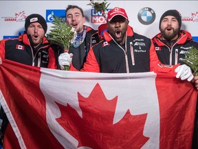 From left to right, second-place finishers Justin Kripps and Alexander Kopacz, and first-place finishers Neville Wright and Chris Spring celebrate together after the World Cup two-man bobsled race in Whistler, B.C., on Friday, Nov. 24, 2017.