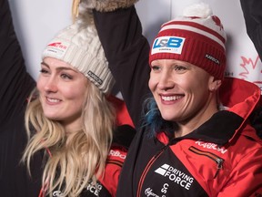 Canada's Kaillie Humphries, right, and Melissa Lotholz celebrate their first-place finish during a women's World Cup bobsleigh race in Whistler, B.C., on Friday Nov. 24, 2017.
