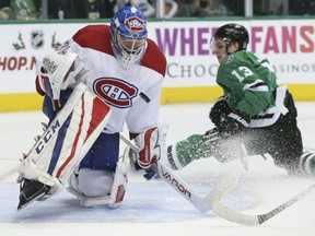Montreal Canadiens goalie Charlie Lindgren blocks a shot against the Stars' Mattias Janmark during the first period of their game in Dallas on Tuesday night.