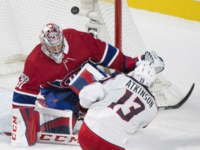 Montreal Candiens goaltender Carey Price holds his ground as he denies Cam Atklinson of the Colombus Blue Jackets from close in during NHL action Monday night in Montreal. Price made 37 saves as the Canadiens posted a 3-1 victory.