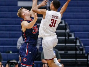 Harvard forward Seth Towns, right, goes up with the ball against Saint Mary's center Jock Landale during the first half of an NCAA college basketball game at the Wooden Legacy tournament Thursday, Nov. 23, 2017, in Fullerton, Calif. (AP Photo/Ringo H.W. Chiu)