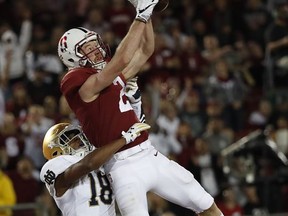 Stanford wide receiver Trenton Irwin (2) catches a touchdown pass in front of Notre Dame cornerback Troy Pride Jr. (18) during the first half of an NCAA college football game Saturday, Nov. 25, 2017, in Stanford, Calif. (AP Photo/Tony Avelar)