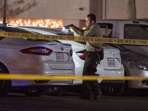 Deputies work on the scene after a shooting Tuesday, Nov. 28, 2017, in Santa Clarita, Calif. A Los Angeles County sheriff's deputy and a suspect were both shot and wounded in gun battle late Tuesday, authorities said. (Hans Gutknecht/Los Angeles Daily News via AP)