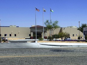 FILE - This May 19, 2015, file photo shows the Adelanto Detention Facility in Adelanto, Calif. The facility is where Saliou Ndiaye an asylum-seeker from Senegal was held and released from after a reported suicide attempt. Ndiaye's attorney Carrye Washington wants the U.S. government to take him back into custody and oversee his medical care. (James Quigg/The Daily Press via AP, File)