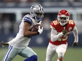 Dallas Cowboys wide receiver Terrance Williams (83) carries the ball after catching a pass as Kansas City Chiefs cornerback Kenneth Acker (25) gives chase in the first half of an NFL football game, Sunday, Nov. 5, 2017, in Arlington, Texas. (AP Photo/Brandon Wade)