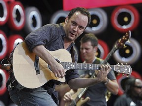 FILE - In this July 7, 2007, file photo, Dave Matthews Band performs during the Live Earth concert at Giants Stadium in East Rutherford, N.J. The Dave Matthews Band will perform in St. Paul, Minn., on the eve of the Super Bowl, adding to a growing list of entertainment leading up to the big game. The Matthews Band will play at Xcel Energy Center on Feb. 3, in St. Paul, as part of the so-called Night Before concert. (AP Photo/Tim Larsen File)