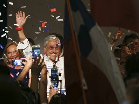 Former Chilean President Sebastian Pinera celebrates the first official results that place him in first place in the elections, in Santiago, Chile, Sunday, Nov. 19, 2017.