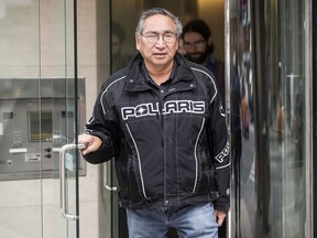 Chief Simon Fobister, of the Grassy Narrows First Nation, leaves a Government Office after a meeting in Toronto on Wednesday November 29, 2017. Leaders from the northern Ontario First Nation met with Government representatives to push for a mercury treatment centre in their community. THE CANADIAN PRESS/Chris Young